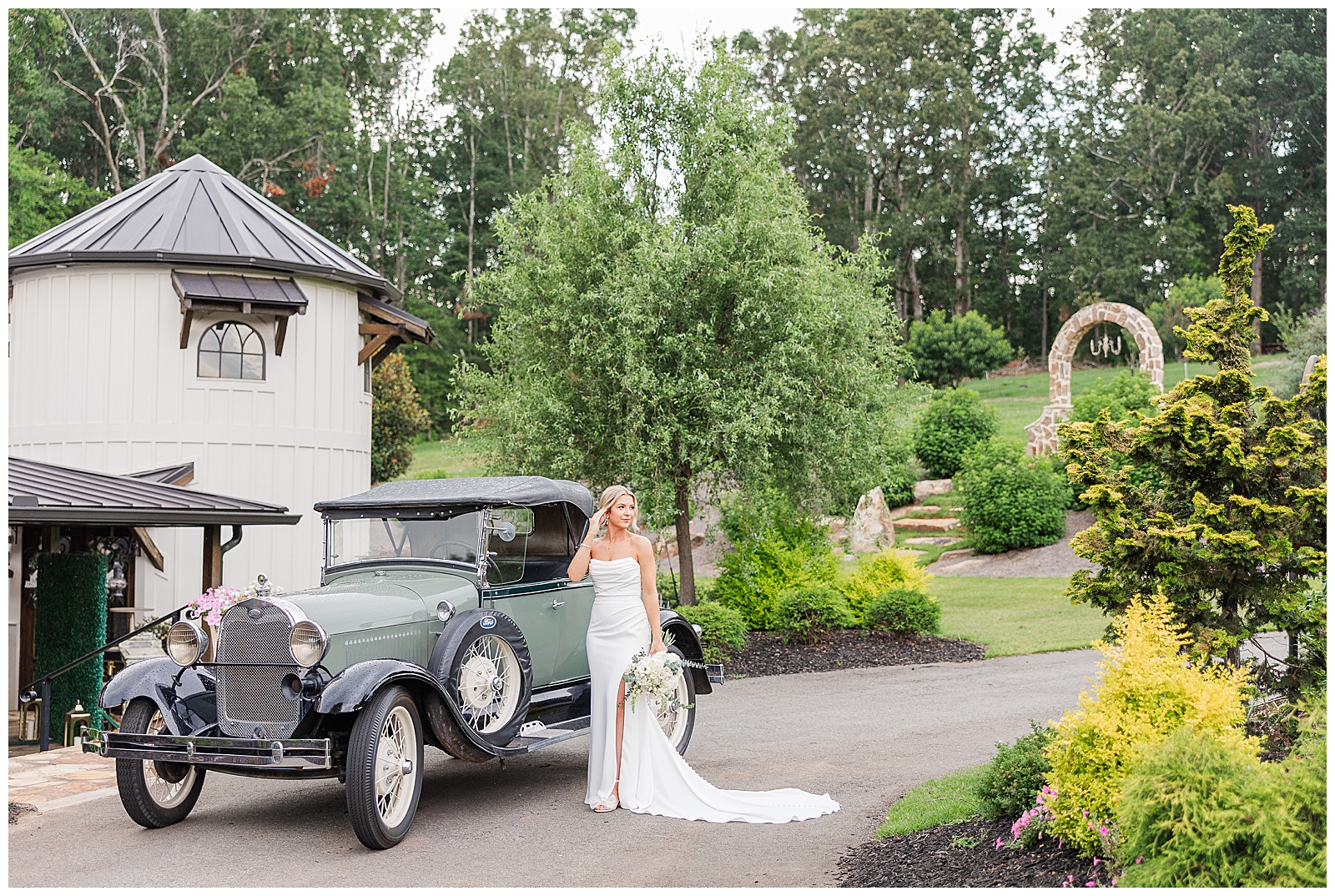 Epic wide shot of bride with antique car at Laceê Meadows venue in Belton, SC